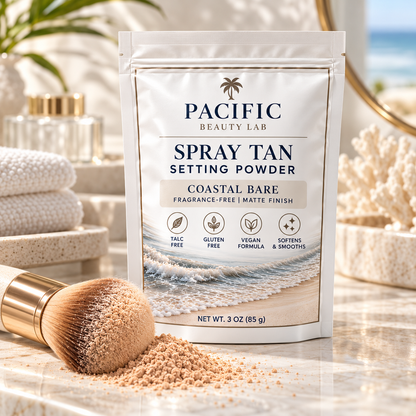 Pacific Beauty Lab Coastal Bare Spray Tan Setting Powder with makeup brush and light neutral powder in a bright coastal vanity setting